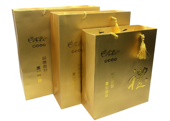 Bom preço. Sacos impressos luxuosos feitos sob encomenda do presente do papel do ouro com os punhos gravados de Logo Tassel on-line